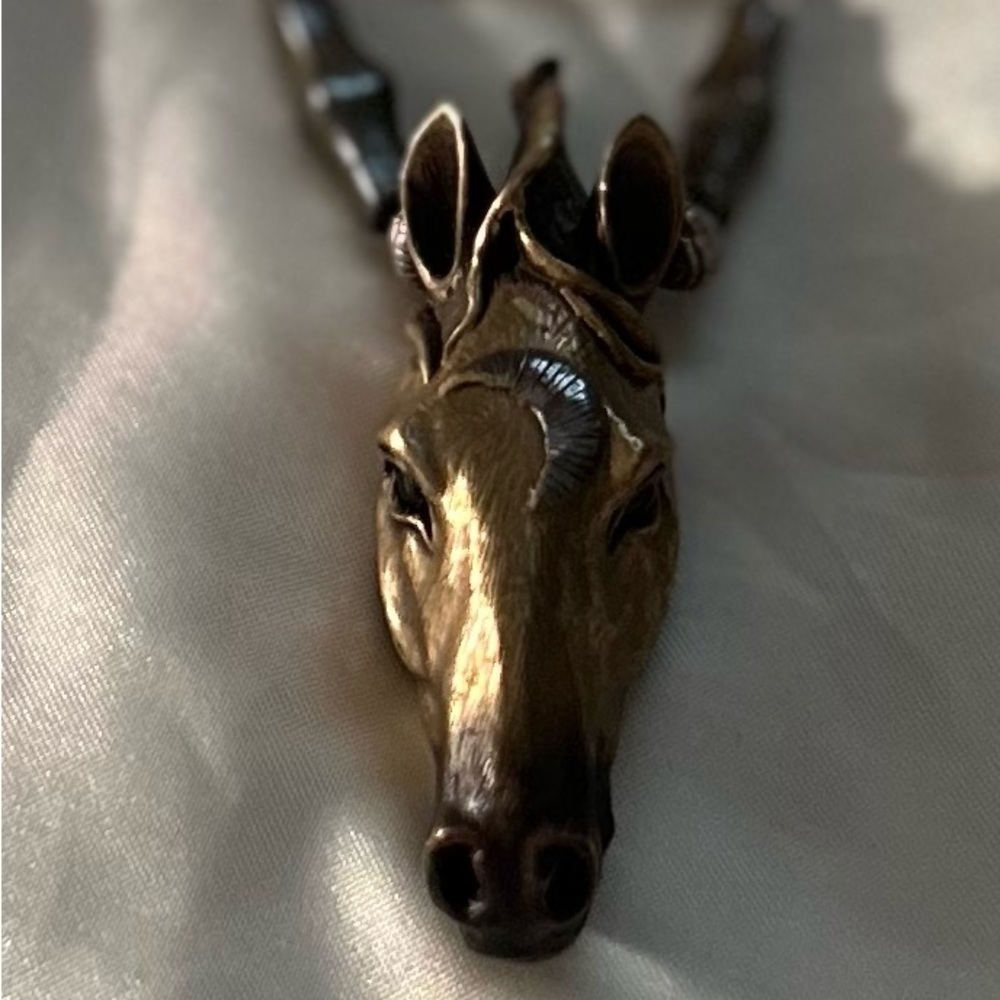 Artist made horse pendant.